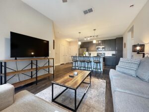 Modern furnished bedroom with king bed and neutral decor